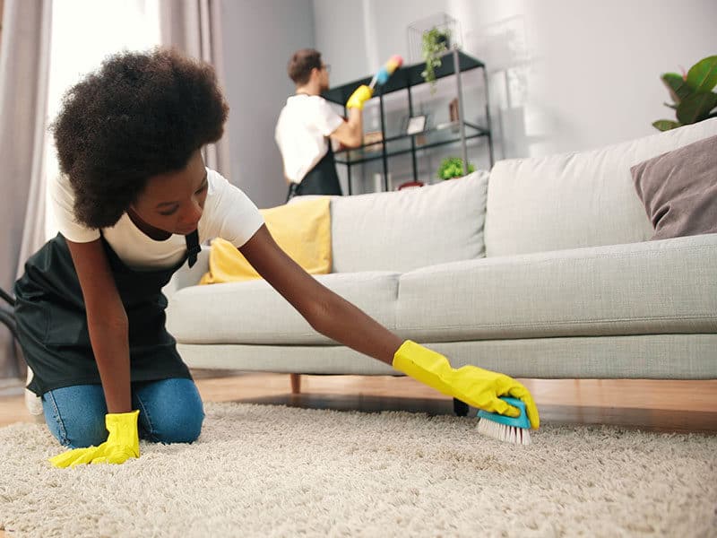 Women Clean Carpet