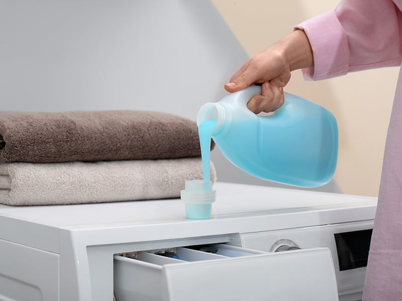 Pouring Laundry Detergent
